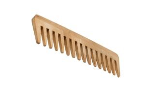 Wooden comb being used on hair with promotional text and graphics about its benefits.