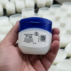 Dispenso Naturals Petrolatum jelly in customer hand