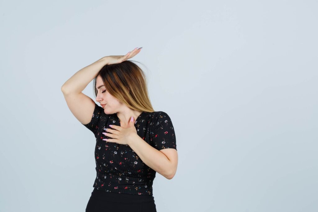 Young woman checking her underarms — looking for the best underarm whitening cream for dark patches